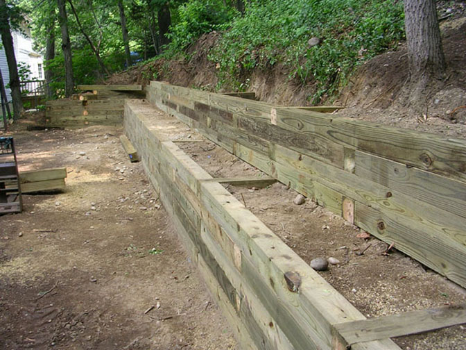 RAILROAD TIE WALLS AND CONCRETE PATIO BUILT IN LONG ISLAND, NY